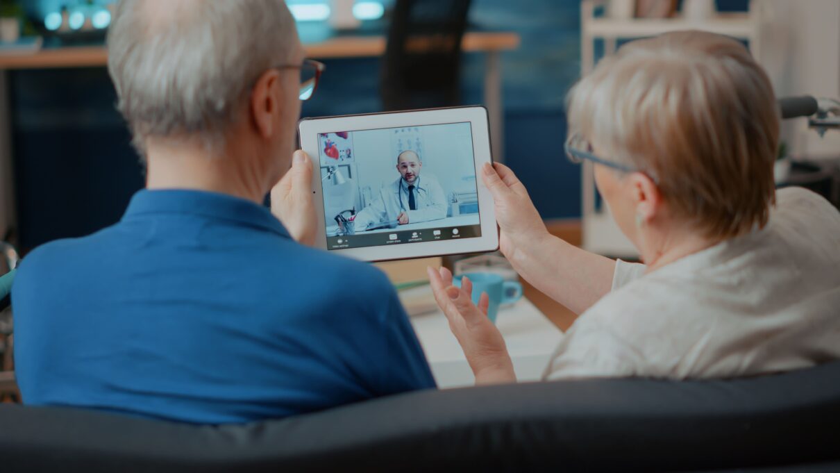 An old man with his wife Discover the truth about telehealth myths.