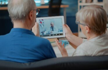 An old man with his wife Discover the truth about telehealth myths.