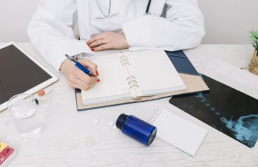 nurse performing a Pre-Employment Physical on a new employee