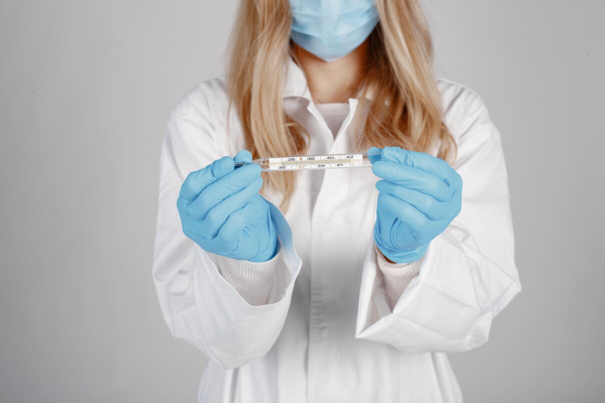 doctor wearing a medical mask holding an STI testing theme isolated white background
