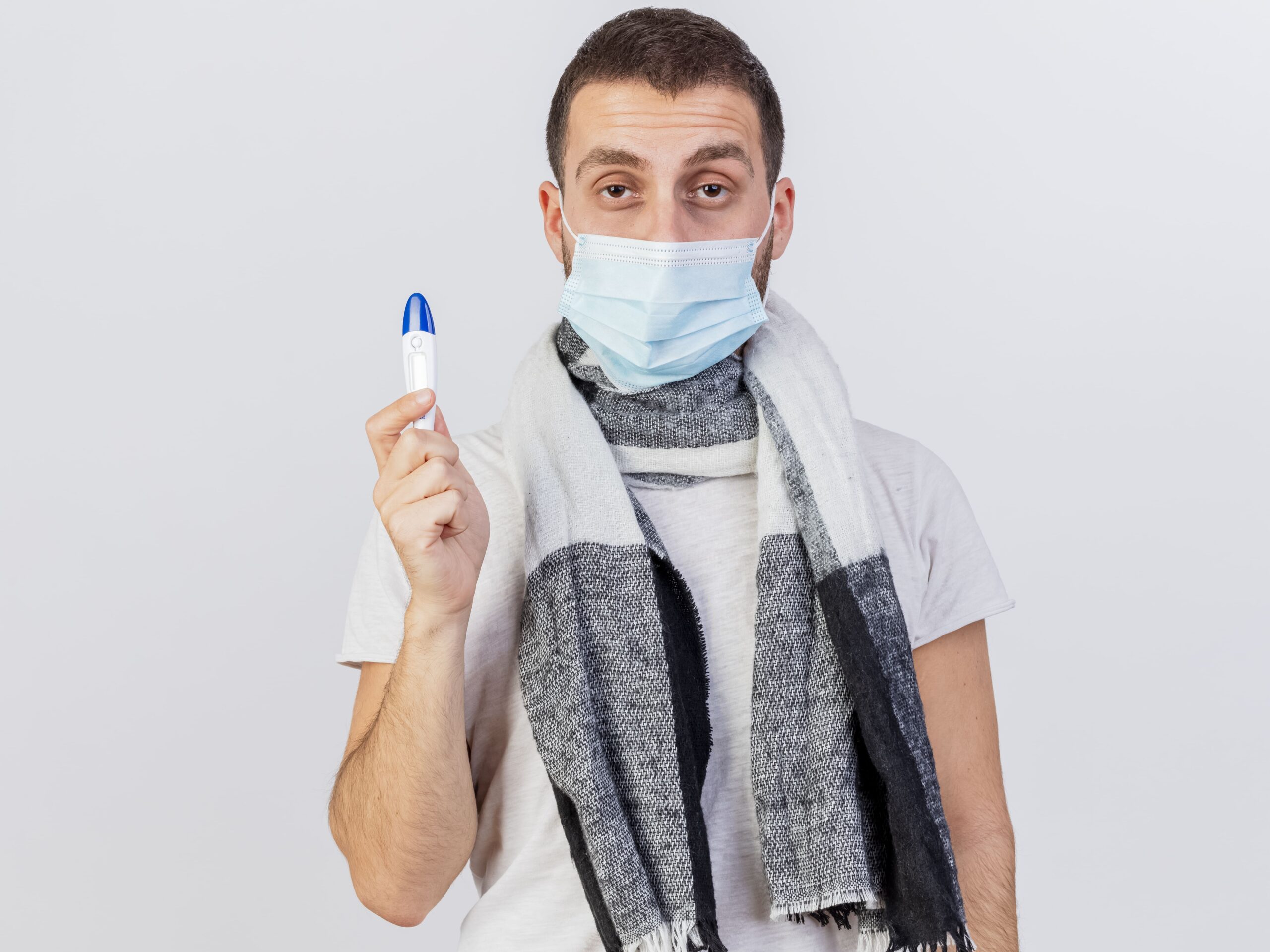 looking camera young ill man wearing medical mask scarf holding thermometer isolated white to warn against subclade K flu strain